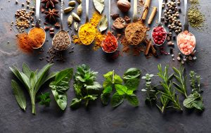 Spices and herbs on a graphite board